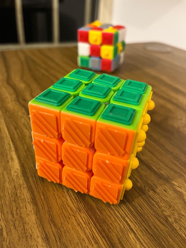 Close-up of the green frame and orange ridge textures on the LVC Dream Cube